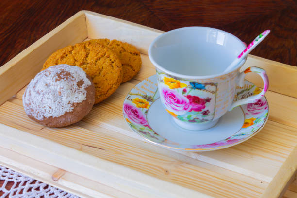 Biscuit cup on a wooden tray