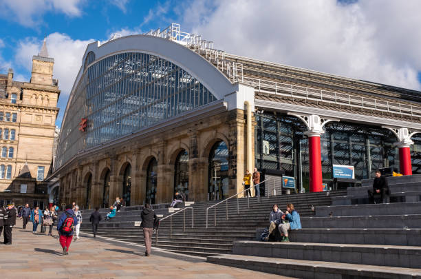 May 27 2023: London England - A Train Stopped in Paddington Station With People Debarking in London England