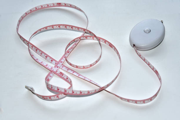 Sewing centimeter centimeter tape tailor's meter measuring tape on a white background