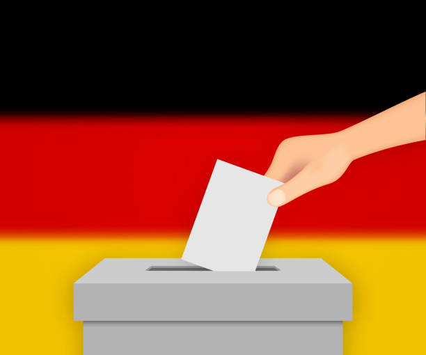 istock Germany election banner background. Ballot Box with blurred flag Template for your design 1385486991