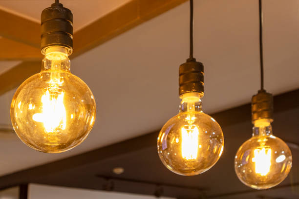 istock Group of old copper lamps hanging from the ceiling 1385487932