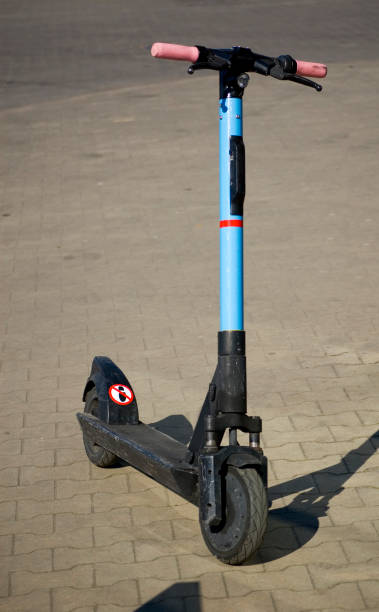 istock Electric scooter parked in the sidewalk. 1385488010