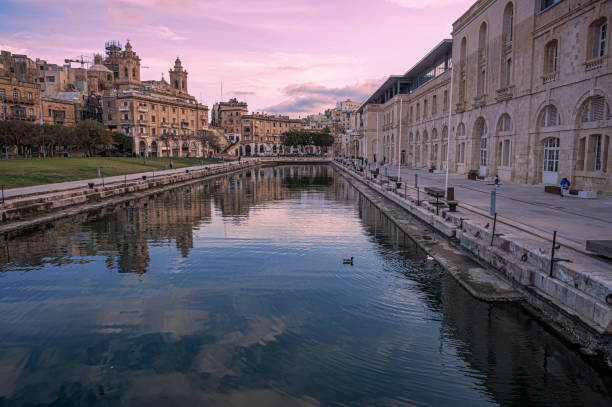 Sunset over small canal in Cospicua, Malta