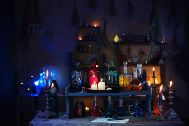 istock magic potions in witch's house with burning candles at night 1385490337