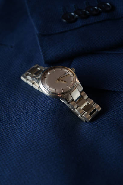 istock Elegant wrist watch on blue jacket 1385494448