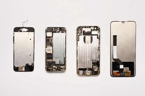 Smart phone parts screen repairing on the white background. Group of mobile phone equipments