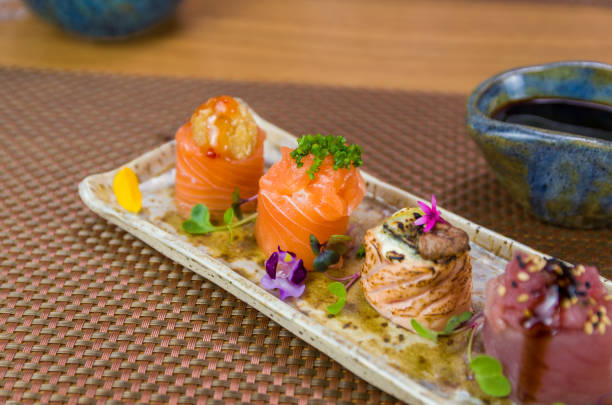 istock Platter decorated with different flavors of elegant gunkan sushi. 1385498884