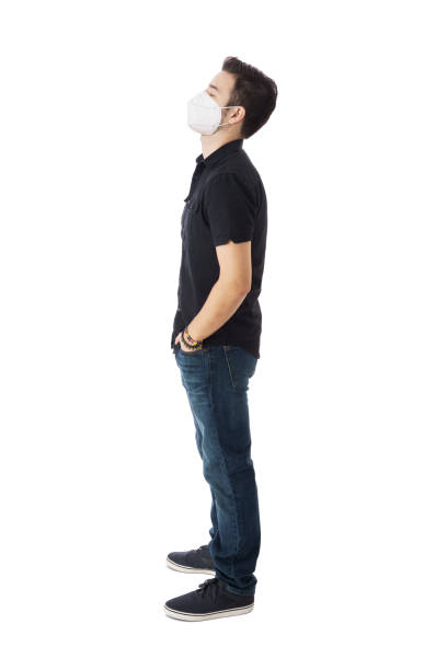 istock Side view of young man with mask and eyes closed 1385501803