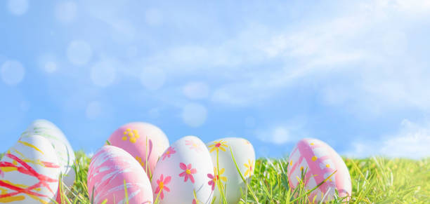 istock Happy Easter! Easter  eggs  on green grass in the  Meadow 1385503427
