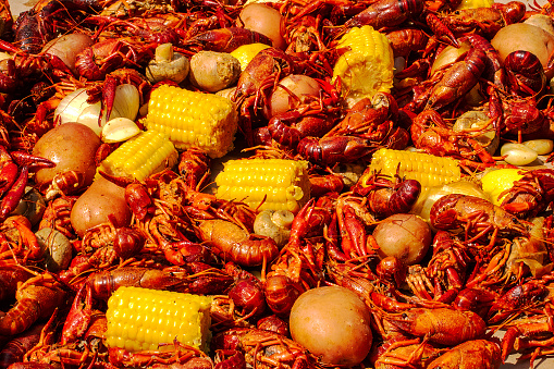 A table of the ingredients to a summer crawfish boil.