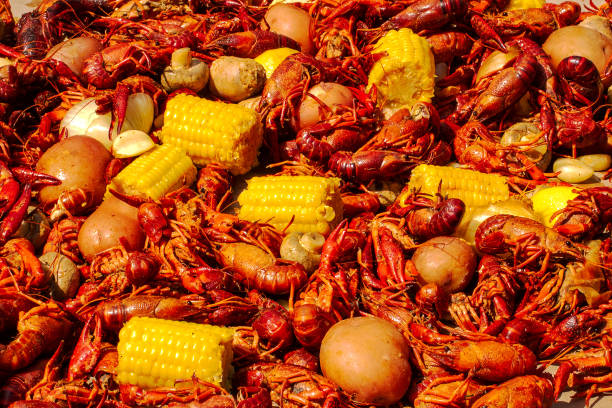 Crawfish Boil A table of the ingredients to a summer crawfish boil. boiling stock pictures, royalty-free photos & images