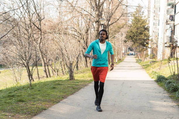 istock African man jogging in the park 1385504766