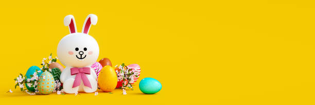 istock White bunny with colorful eggs and decoration on yellow Easter background 1385505470