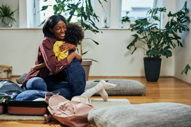 istock Mother and daughter hugging at home 1385505485