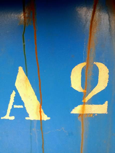istock Photograph of character painted on blue background with rust streaks 1385505968