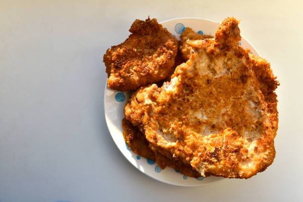 Pieces of fried pork meat on a plate