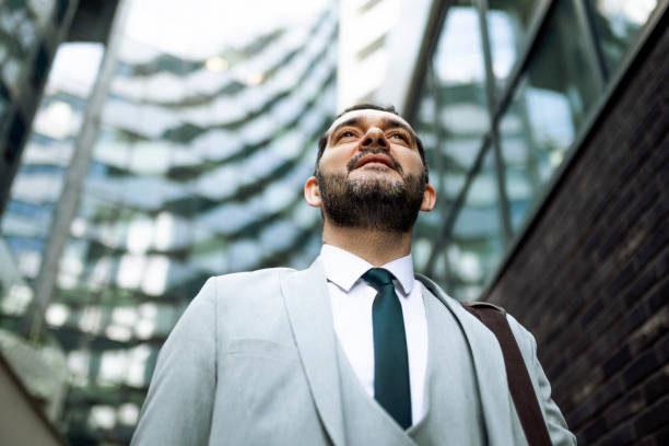 istock Serious businessman in a city 1385508019
