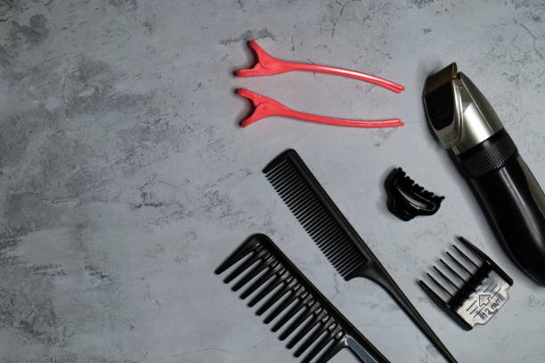 istock Professional tools for a barber shop on a gray background. 1385508968