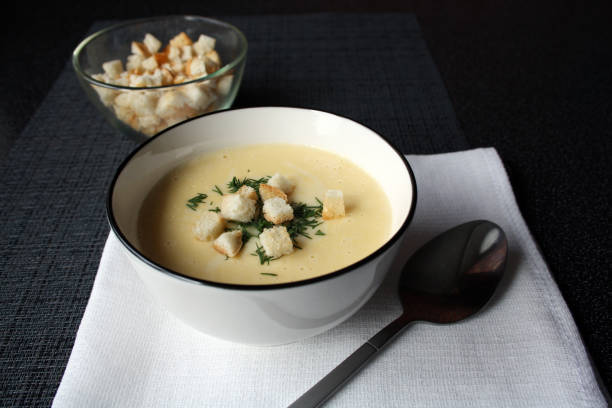 istock Cheese soup in a white bowl. 1385510486