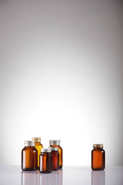 Set of empty brown glass medicine bottles. Amber bottle samples.