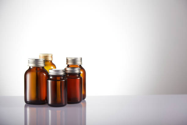 istock Set of empty brown glass medicine bottles. Amber bottle samples. 1385514356