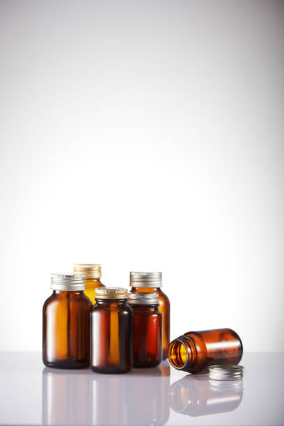 istock Set of empty brown glass medicine bottles. Amber bottle samples. 1385514359