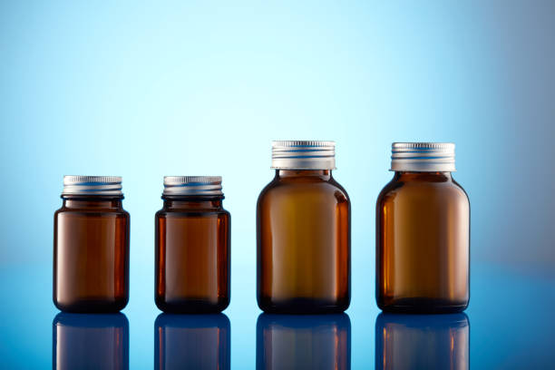 istock Set of empty brown glass medicine bottles. Amber bottle samples. 1385514361