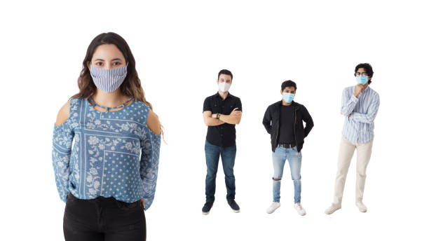 istock Young people standing with face mask and looking at camera 1385516146