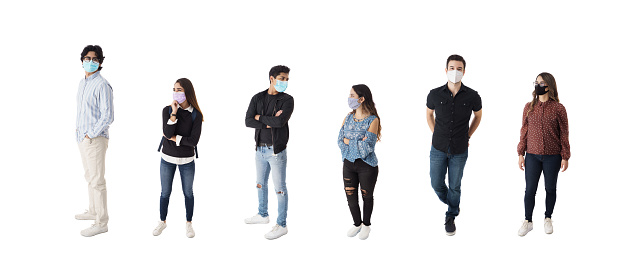 Latin students standing  in line and wearing face masks