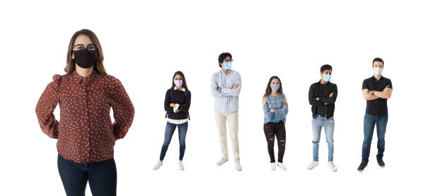 istock Some latin students with masks standing in line with arms crossed 1385516210