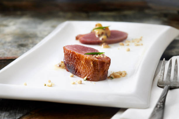Red curry duck with grapes are served in Thai restaurant