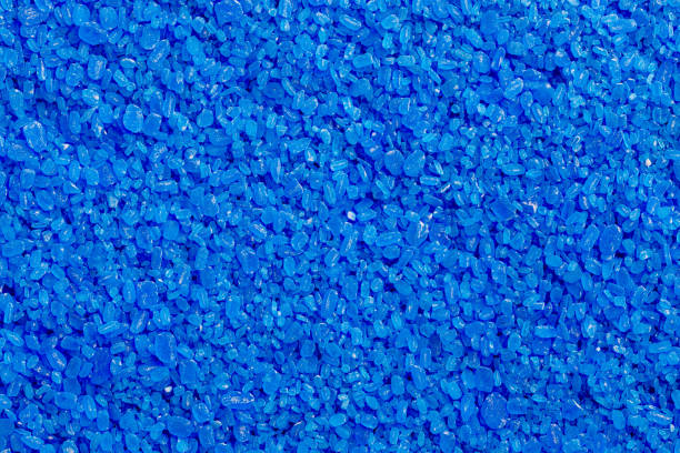 istock full frame background and texture of blue copper sulfate granules - close-up 1385517744