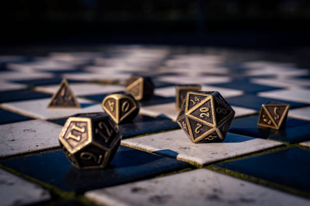 close-up of a set of roleplaying dice on black and white tiles - the polyhedron imagens e fotografias de stock