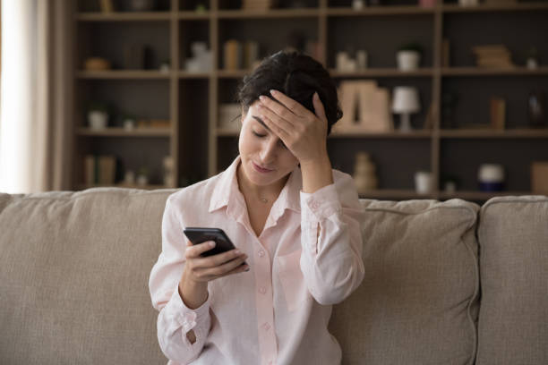 istock Unhappy young Hispanic woman dissatisfied with bad device work. 1385517923