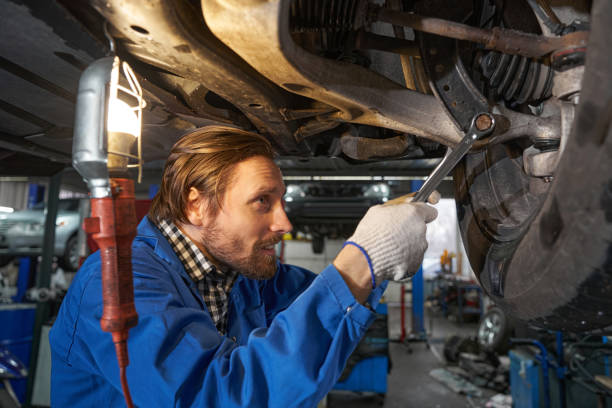 istock Portrait of man performing machine diagnostics at service station 1385518070