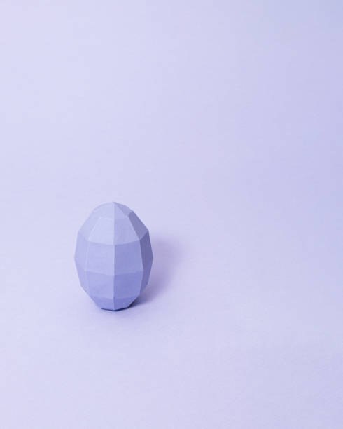 istock Geometric Easter egg on pastel purple background with copy space. Minimal monochromatic Easter concept. 1385519881
