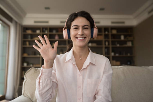 istock Web camera view cheerful millennial Hispanic woman starting video call. 1385519900