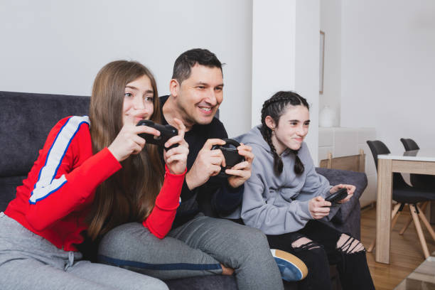 istock Father and daughters with virtual reality glasses. 1385520118