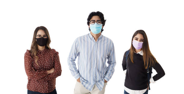 istock Three young people with masks looking at camera 1385520317