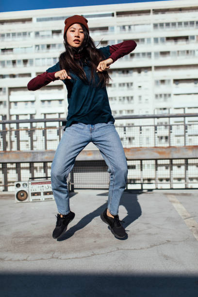 istock Young beautiful girl dancing 1385521382