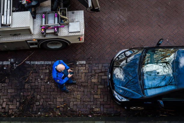 Parking official writhing a fine in Amsterdam, The Netherlands stock photo