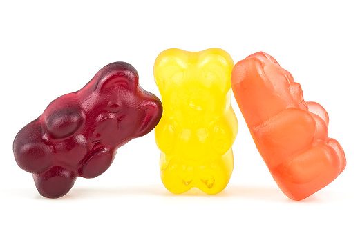 Sweet jelly marmalade bears isolated on a white background. Group of colorful fruit gummy candies.