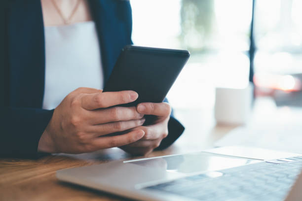 istock Close up of man using mobile phone. 1385521744