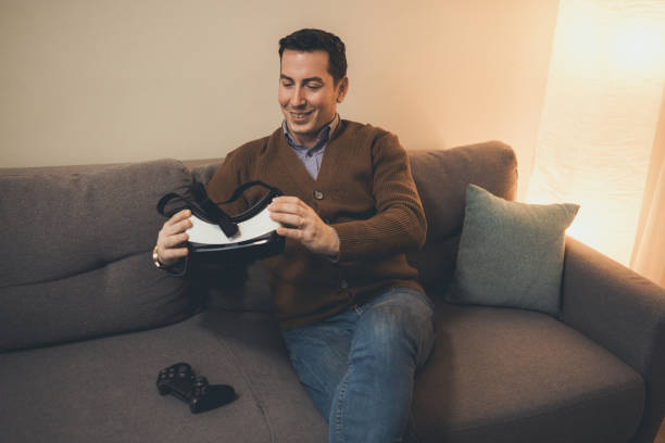 istock A man playing video game using VR and gamepad at home 1385522715