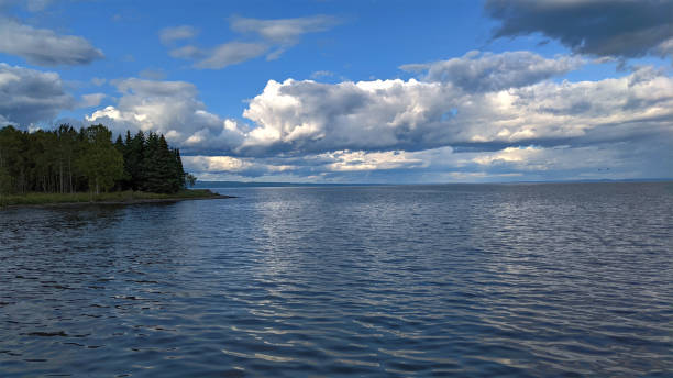 Calmer lake as the light on it is from the clouds facing the sun - Lake Superior - Thunder Bay, ON, Canada stock photo