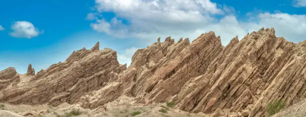 Photo of Quebrada de las flechas (Arrows Creek), Argentina Route 40. Stunning spiky rock formations pointing diagonally upwards and thus resembling arrows, Salta Province, Argentina