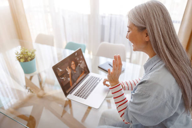 istock Woman using notebook for online communication at home 1385526307