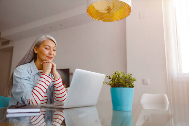 istock Woman working on modern portable laptop at home 1385526363