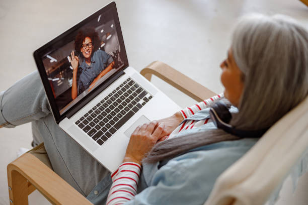 istock Woman using modern notebook for online communication at home 1385526379