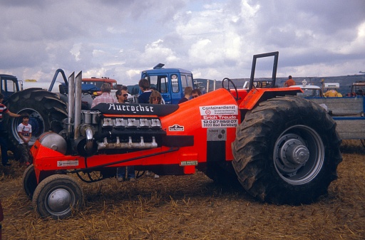 Near Cologne on the Lower Rhine, Germany, 1978. Tractor tuner meeting on a field on the Lower Rhine. Also: owners and visitors.